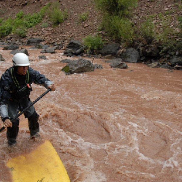 a man riding a bike down a dirt road