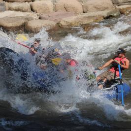 a man riding a wave on a surfboard in the water