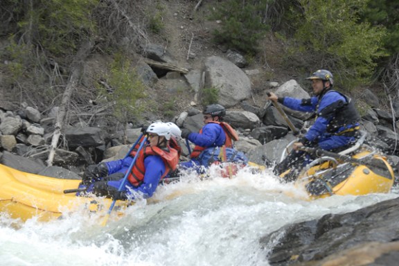a group of people riding on a raft