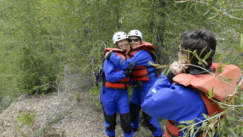 a little boy that is standing in the grass