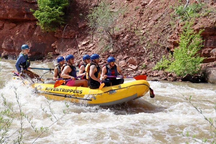 a group of people riding on the back of a boat