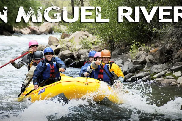 a group of people on a raft in the water